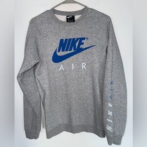 Size Small Nike Gray Crewneck with blue letters and letters on the left side